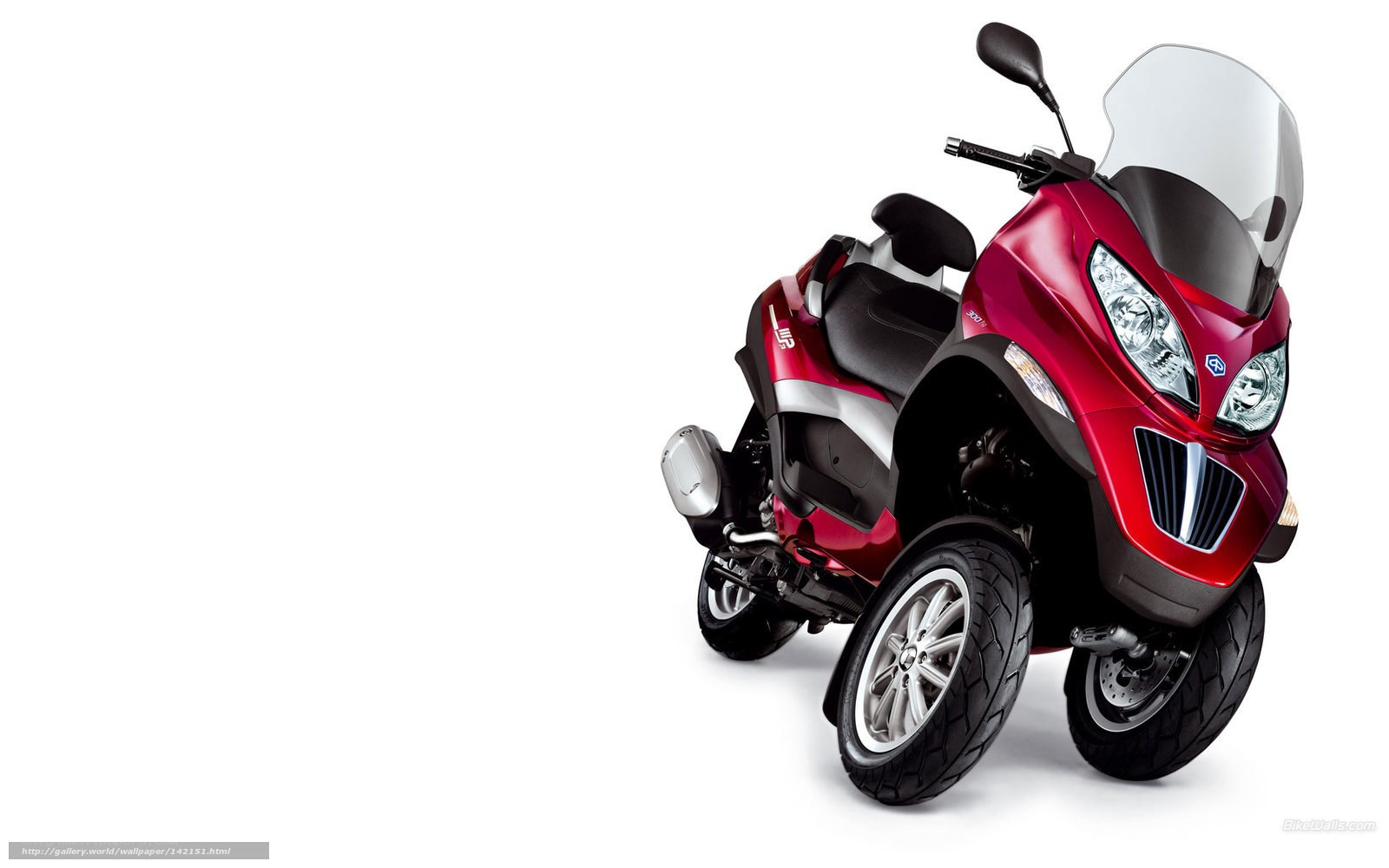 Red three-wheeled scooter