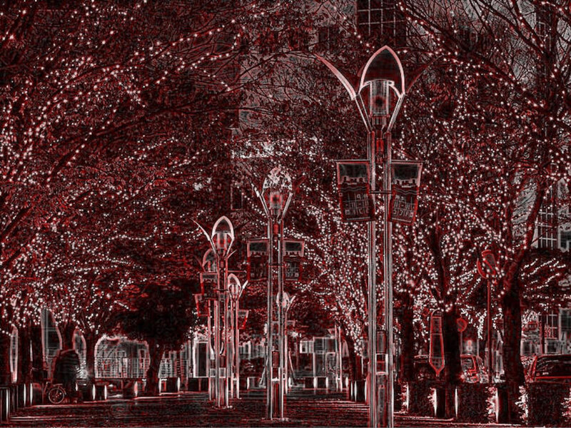 Red-tinted city street with lights