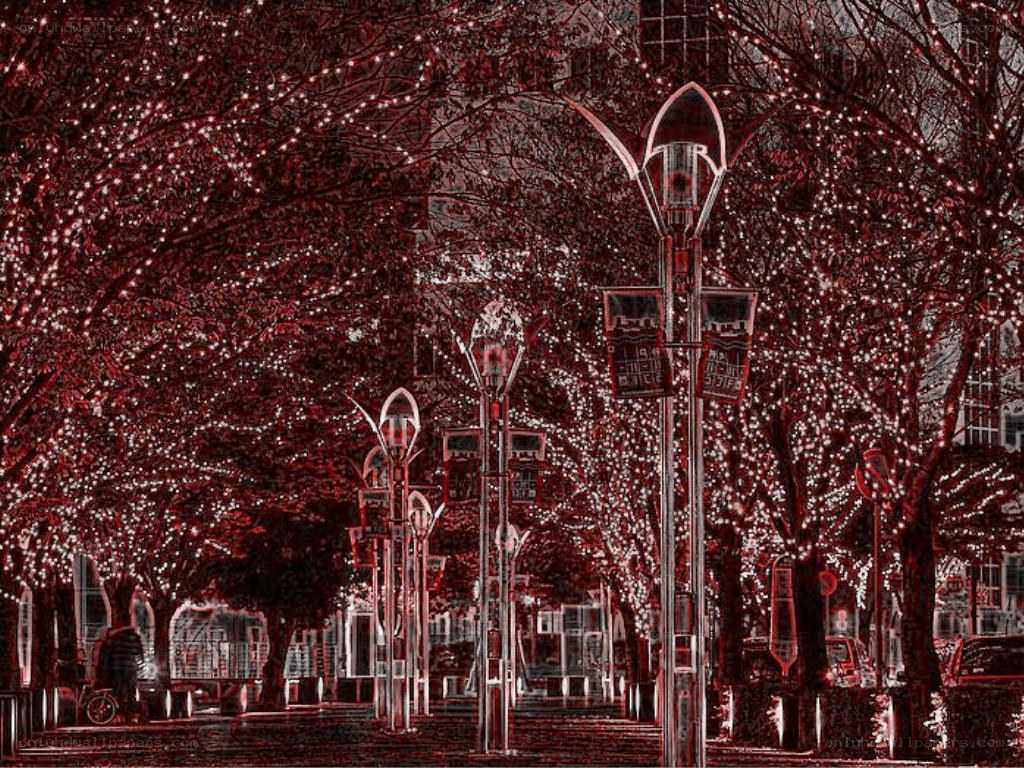 Red-tinted city street with lights