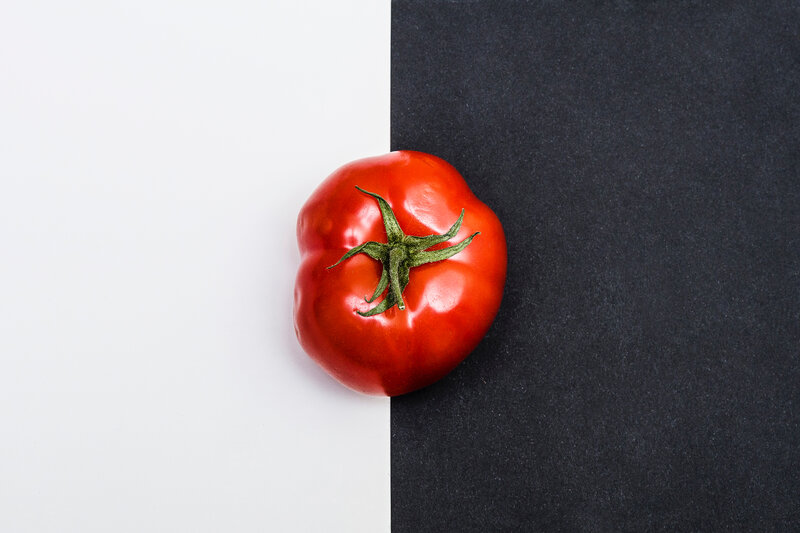 red tomato on black and white