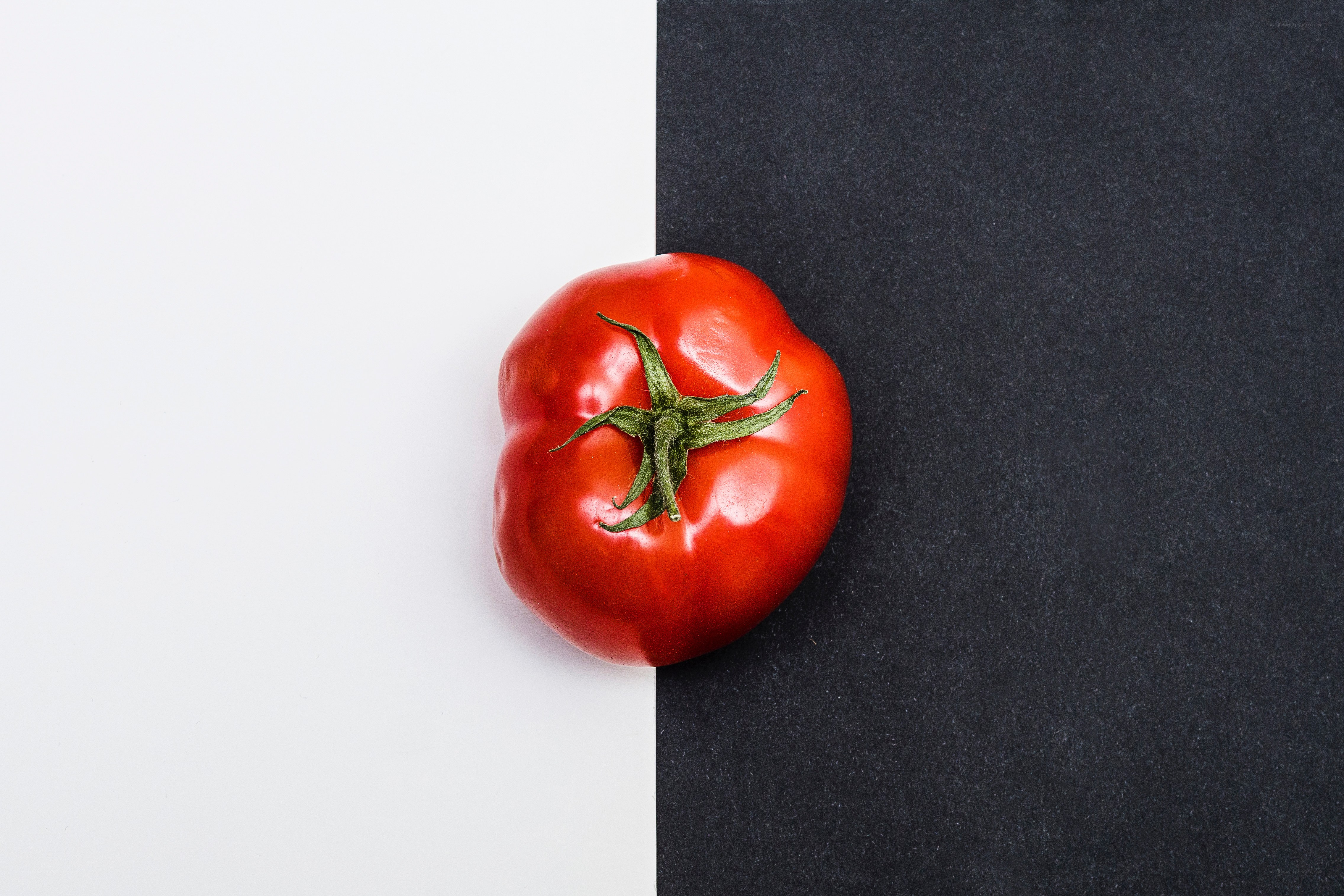 red tomato on black and white