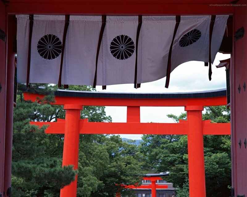 Red torii gate with banners