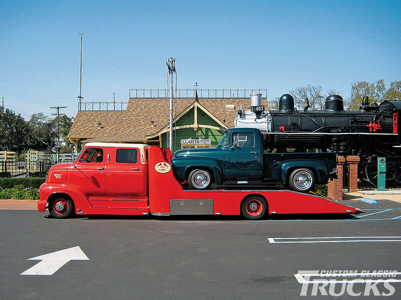 Red Tow Truck Carrying Trucks