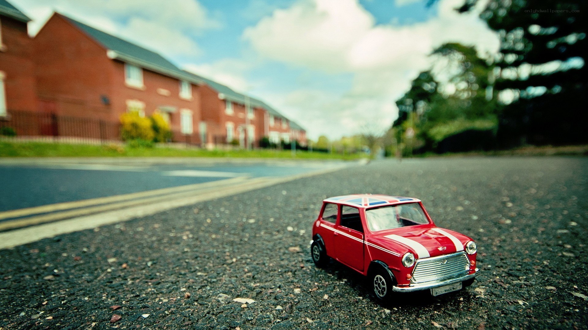 Red toy car on a street