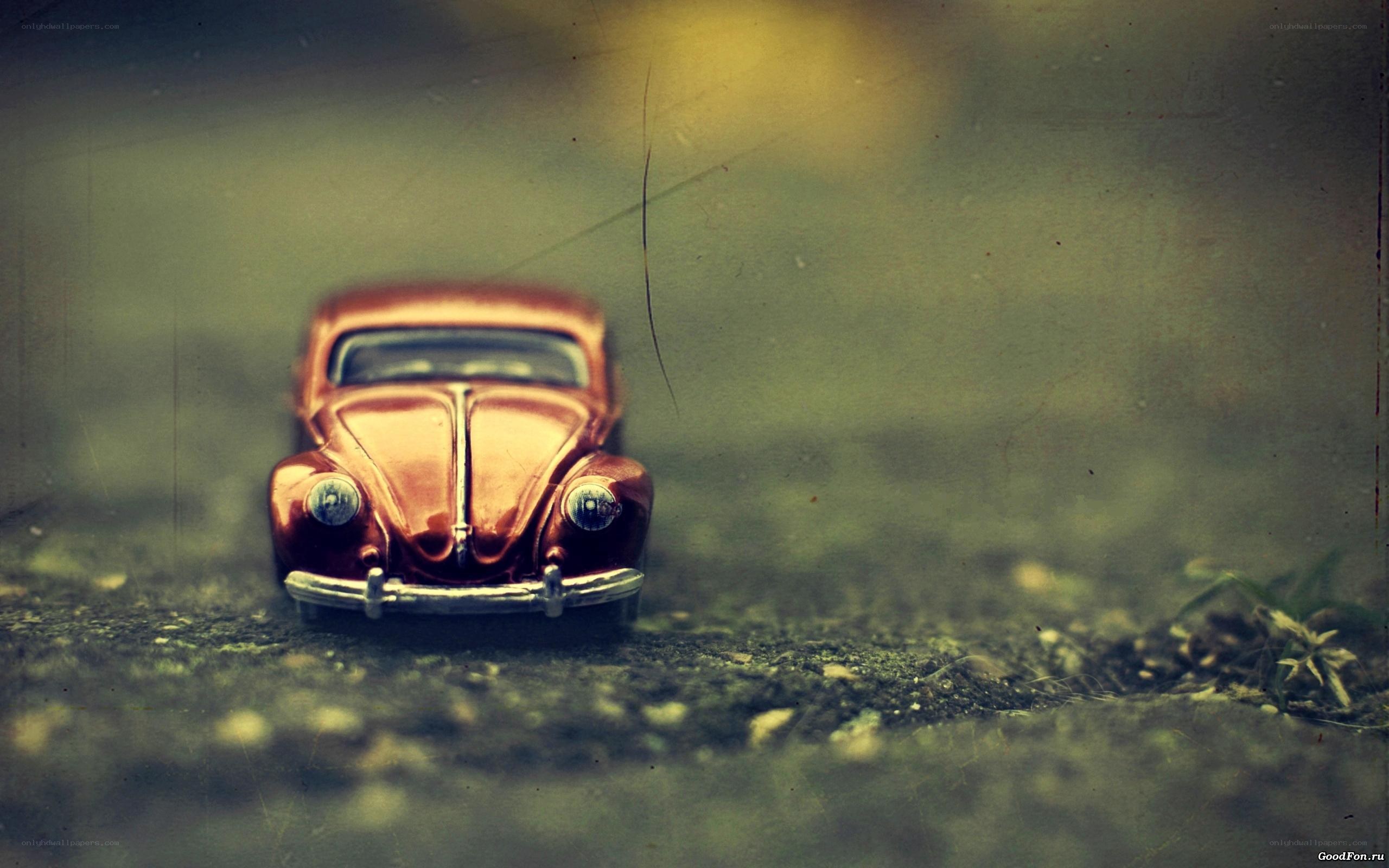Red toy car on ground