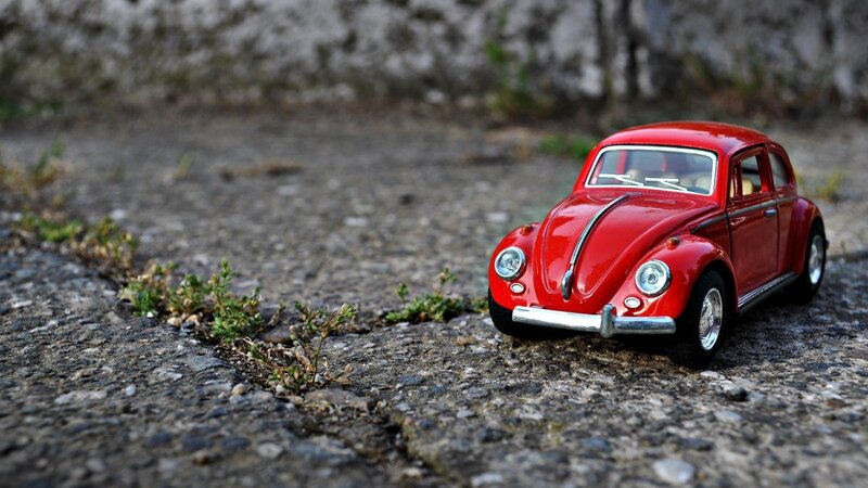 Red Toy Car on Pavement — Calm, Photograph