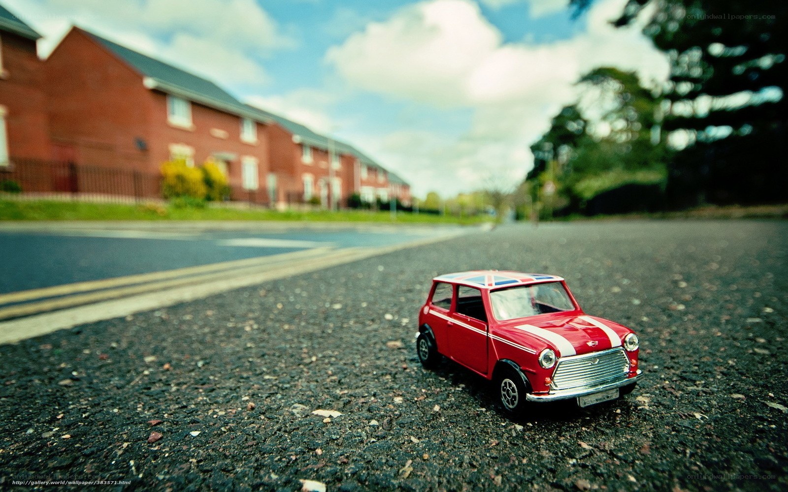 Red toy car on street