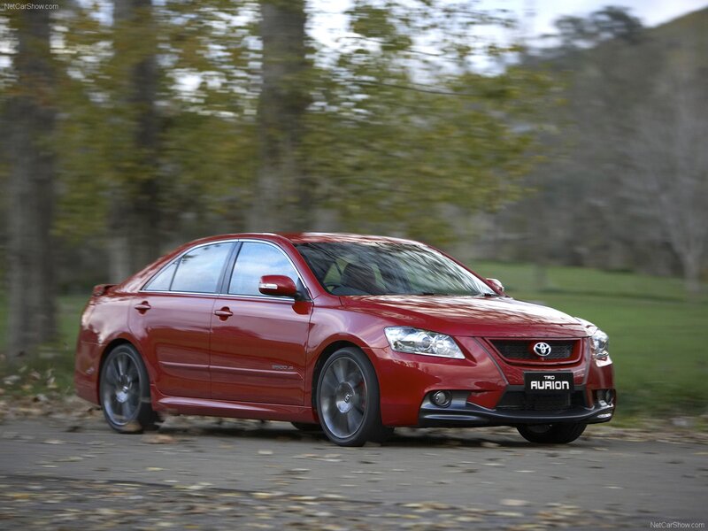 Red Toyota Aurion in motion