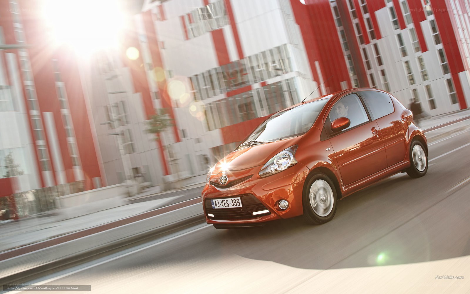 Red Toyota Aygo in city
