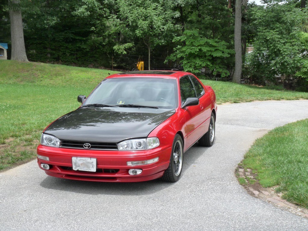 red toyota camry on driveway