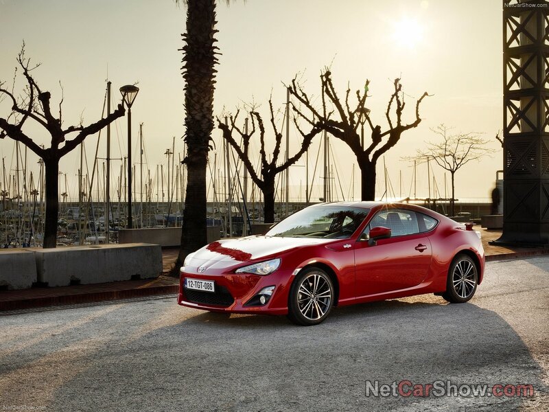 Red Toyota GT-86 at marina