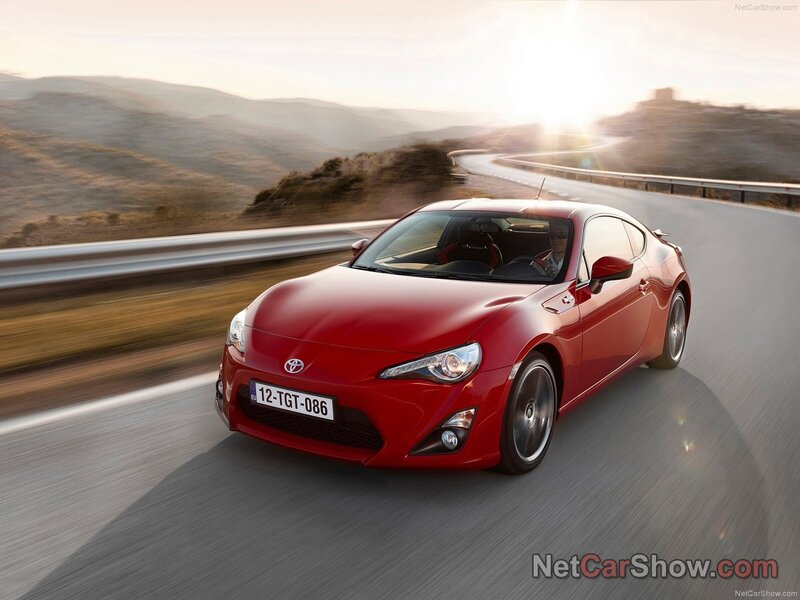 Red Toyota GT-86 on a winding road