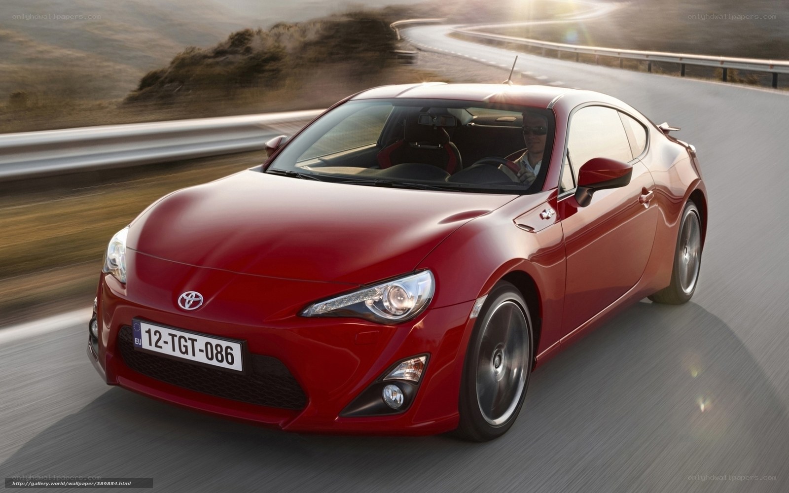 Red Toyota GT86 on a winding road