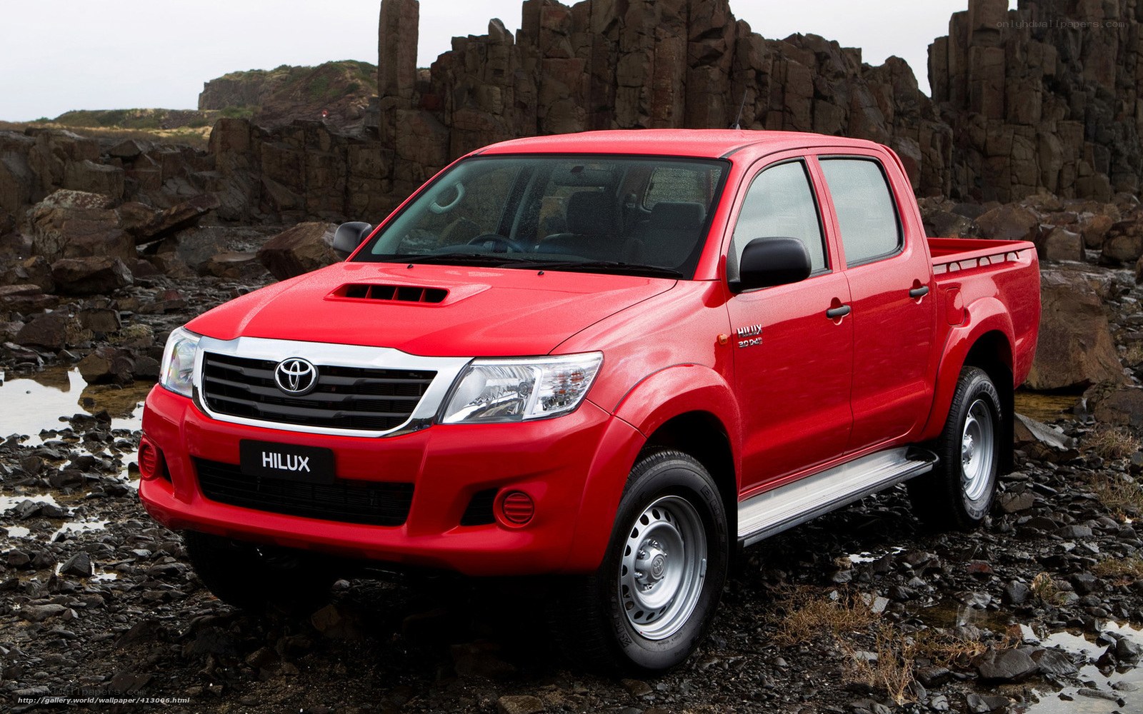 Red Toyota Hilux pickup truck