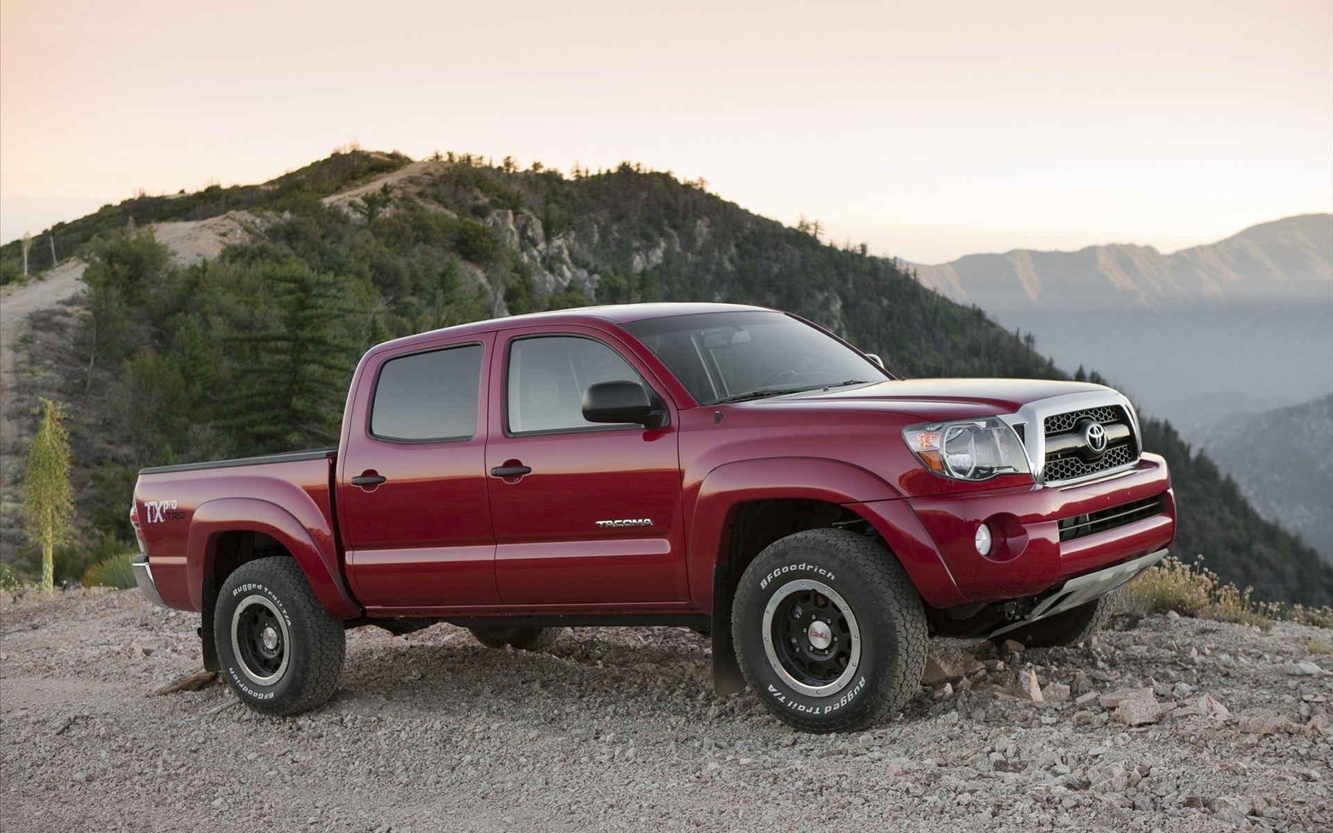 Red Toyota Tacoma on mountain