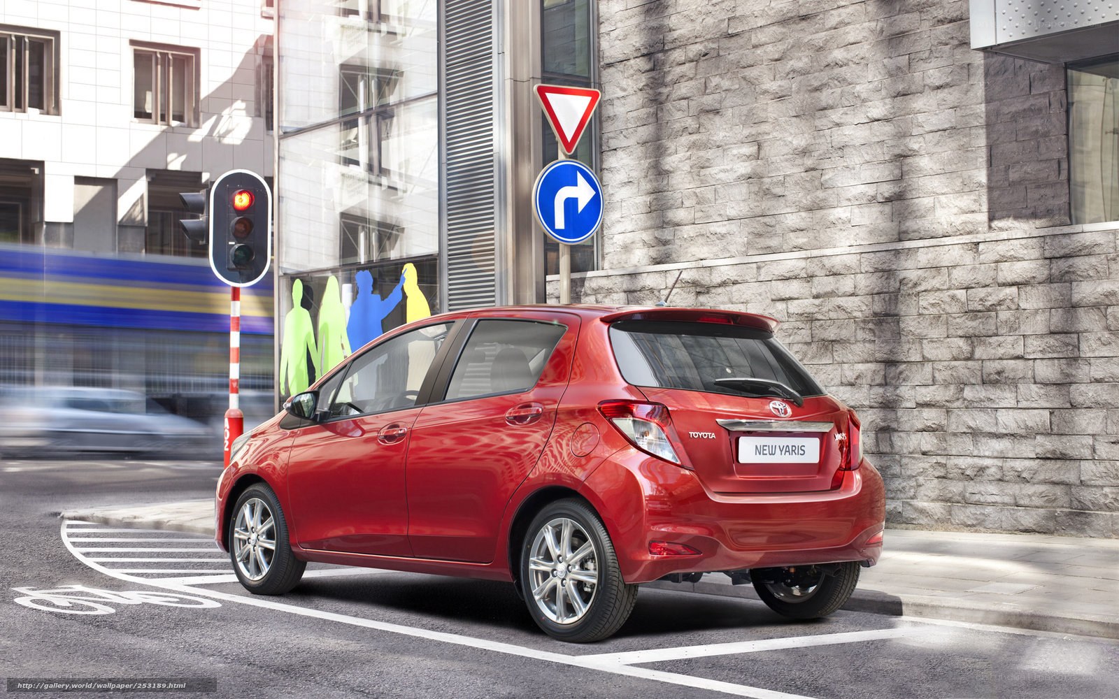 Red Toyota Yaris at intersection