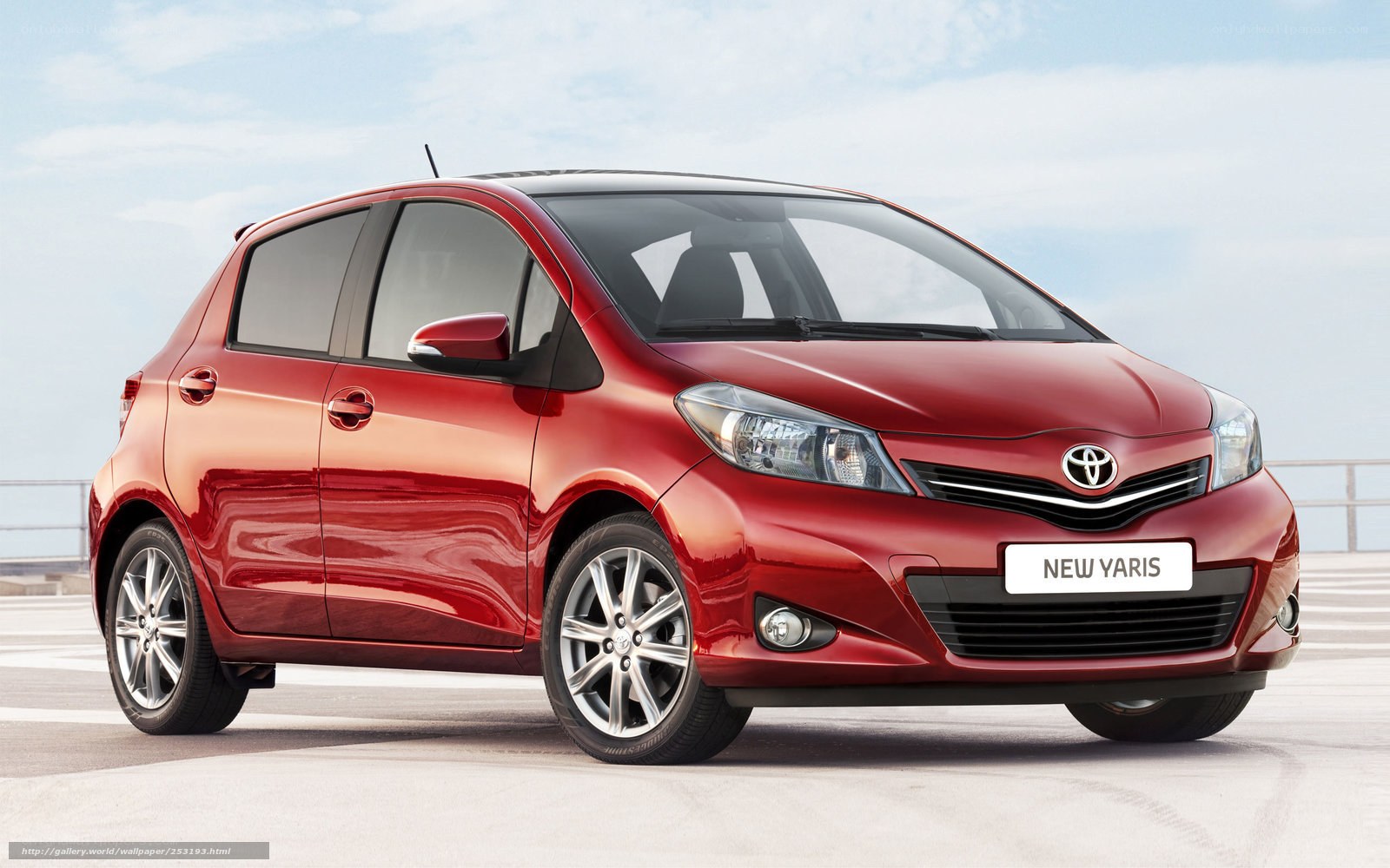 Red Toyota Yaris hatchback