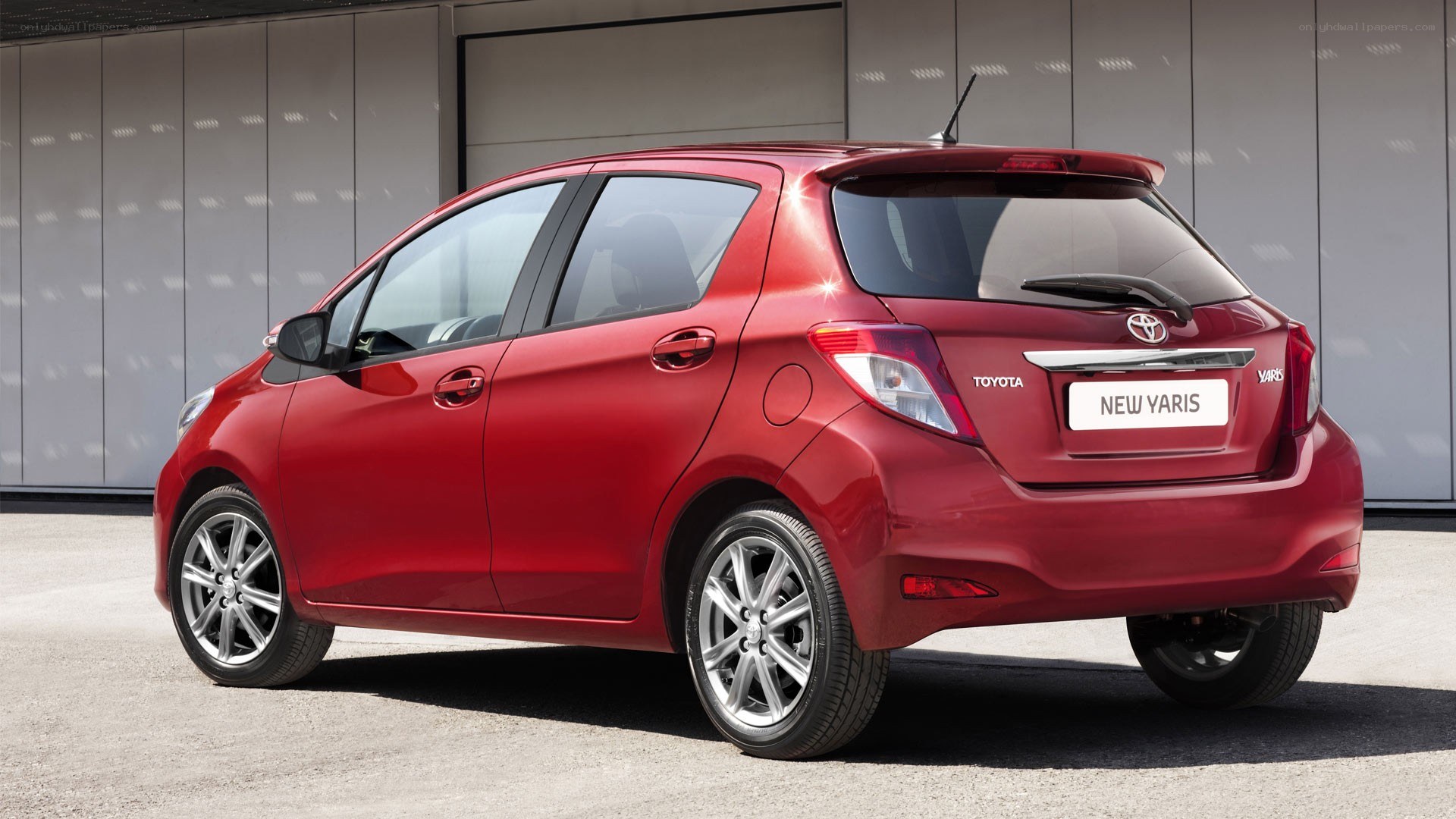 Red Toyota Yaris hatchback