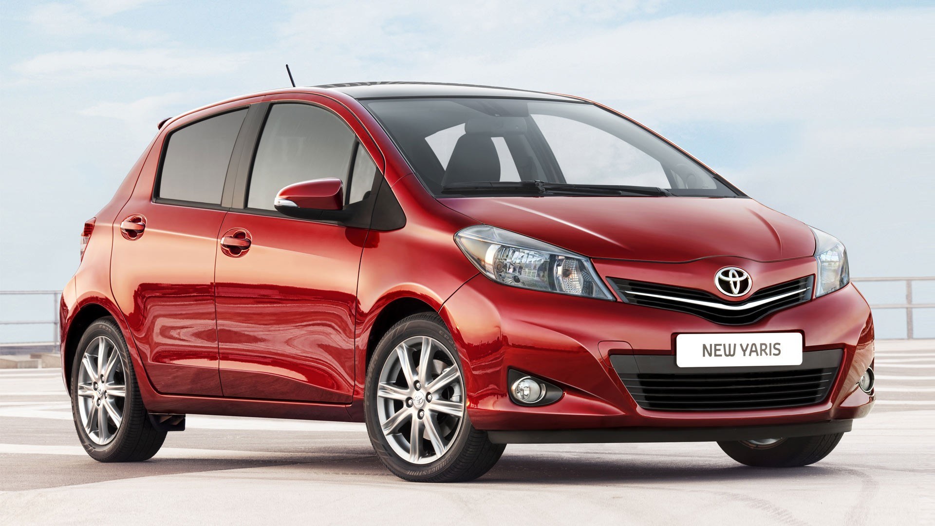 Red Toyota Yaris hatchback