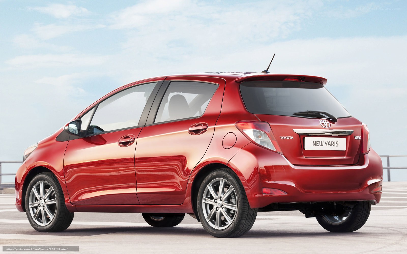 Red Toyota Yaris hatchback