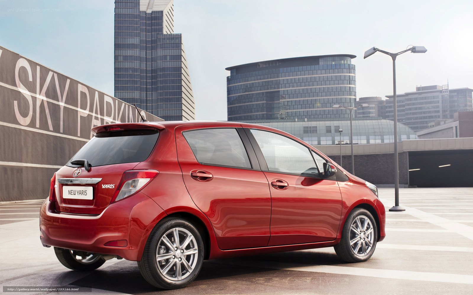 Red Toyota Yaris in city