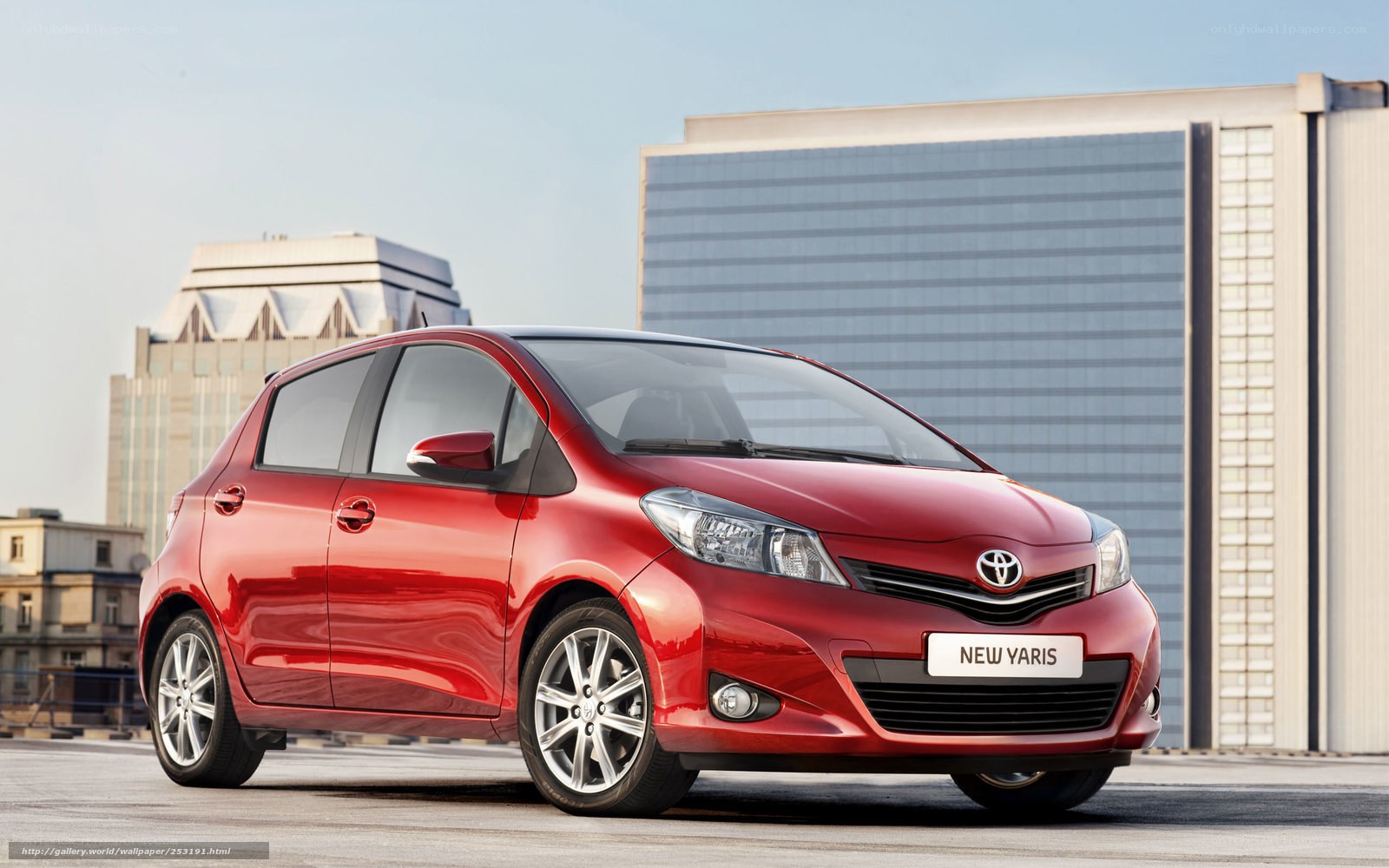 Red Toyota Yaris in city