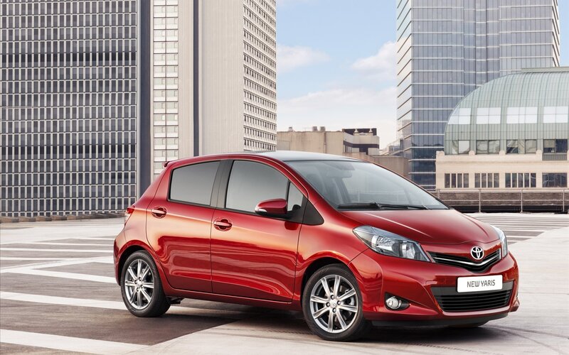Red Toyota Yaris in city