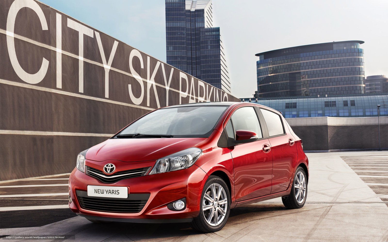 Red Toyota Yaris in city