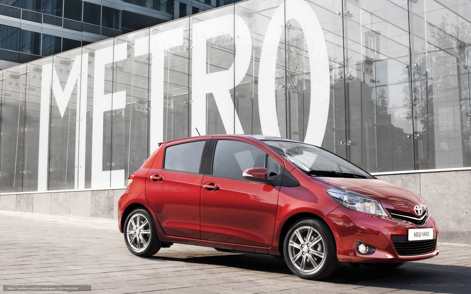 Red Toyota Yaris in urban setting