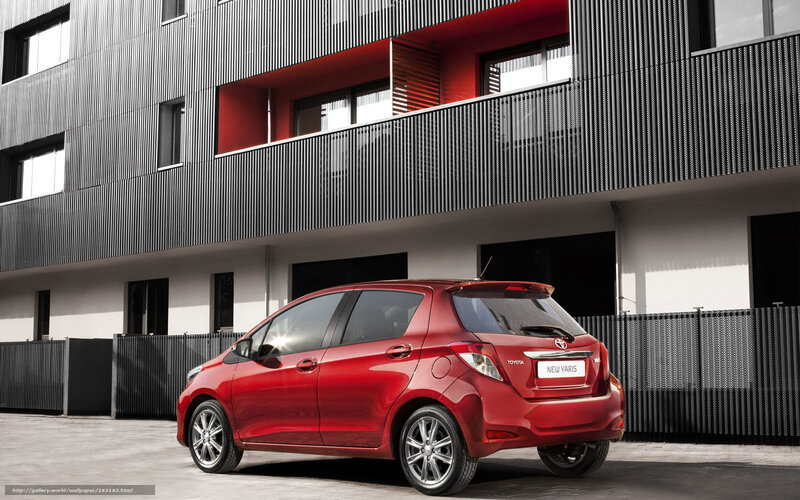 Red Toyota Yaris in urban setting