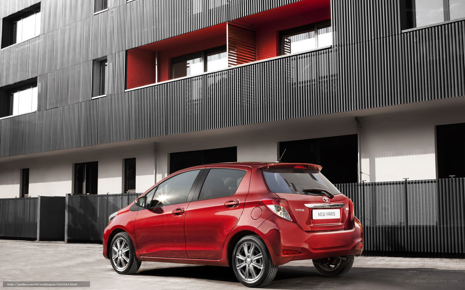 Red Toyota Yaris in urban setting