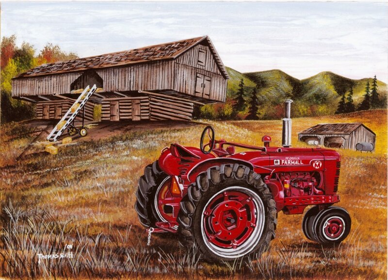 Red tractor in a farm field