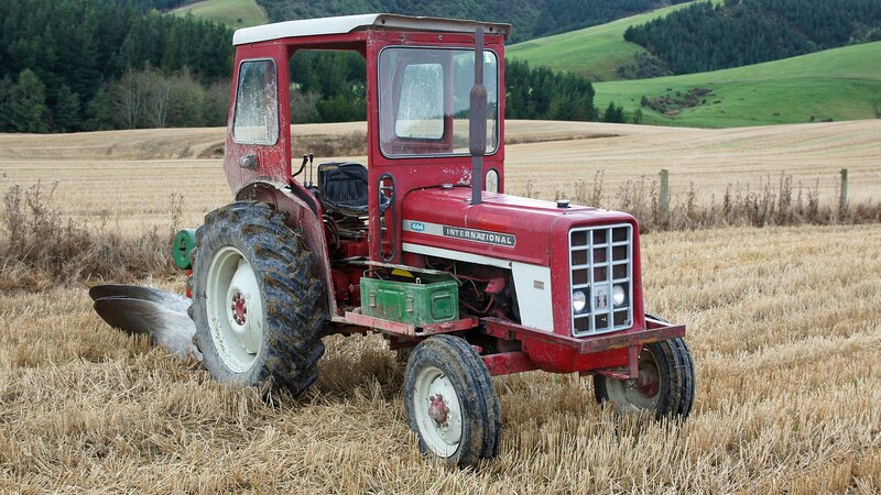 Red Tractor in Field — Rural