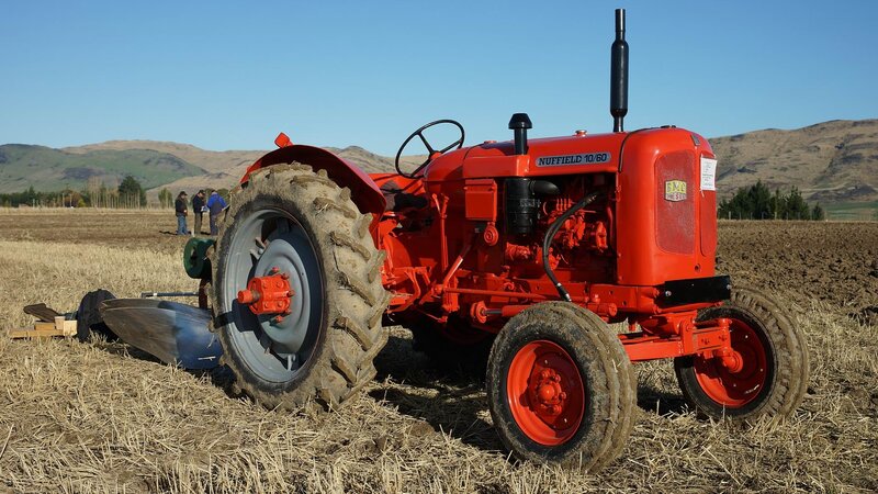 Red Tractor in Field — Serene