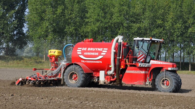 Red Tractor in Field — Working