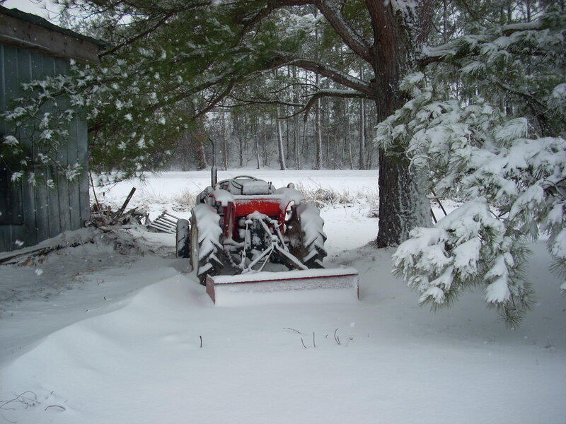 Red Tractor in Snow