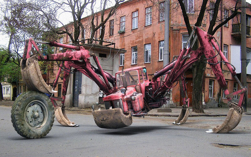 Red tractor spider sculpture