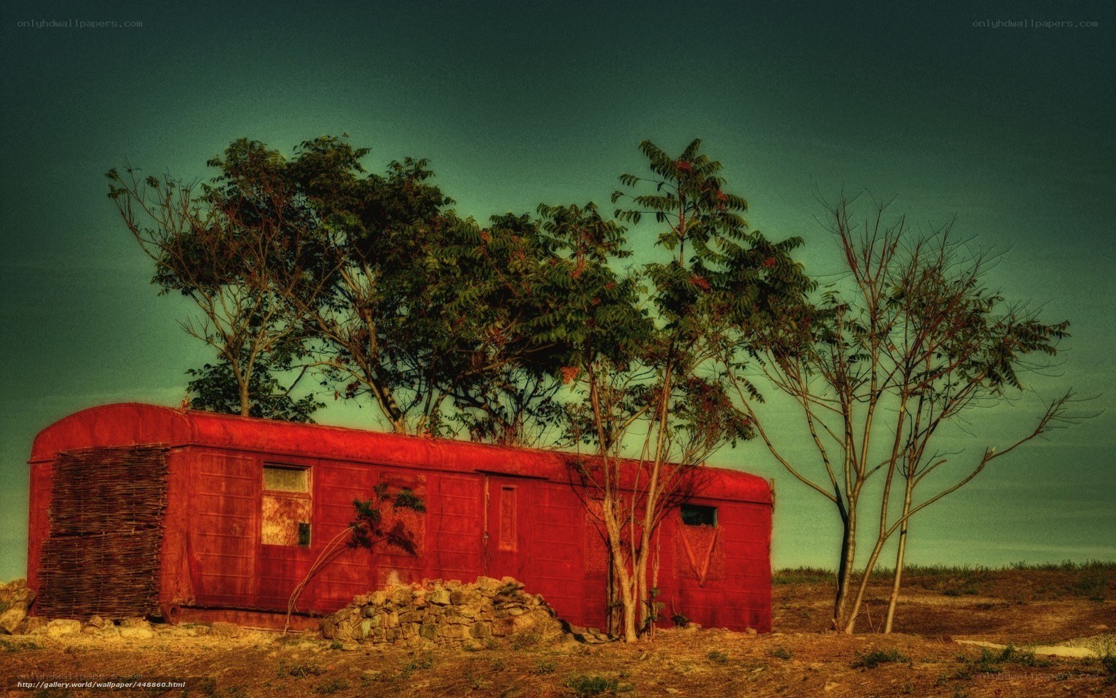 Red trailer in rural landscape