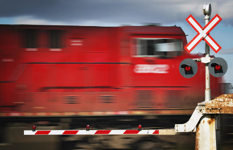Red Train at Crossing