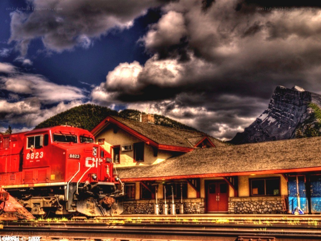 Red train at mountain station
