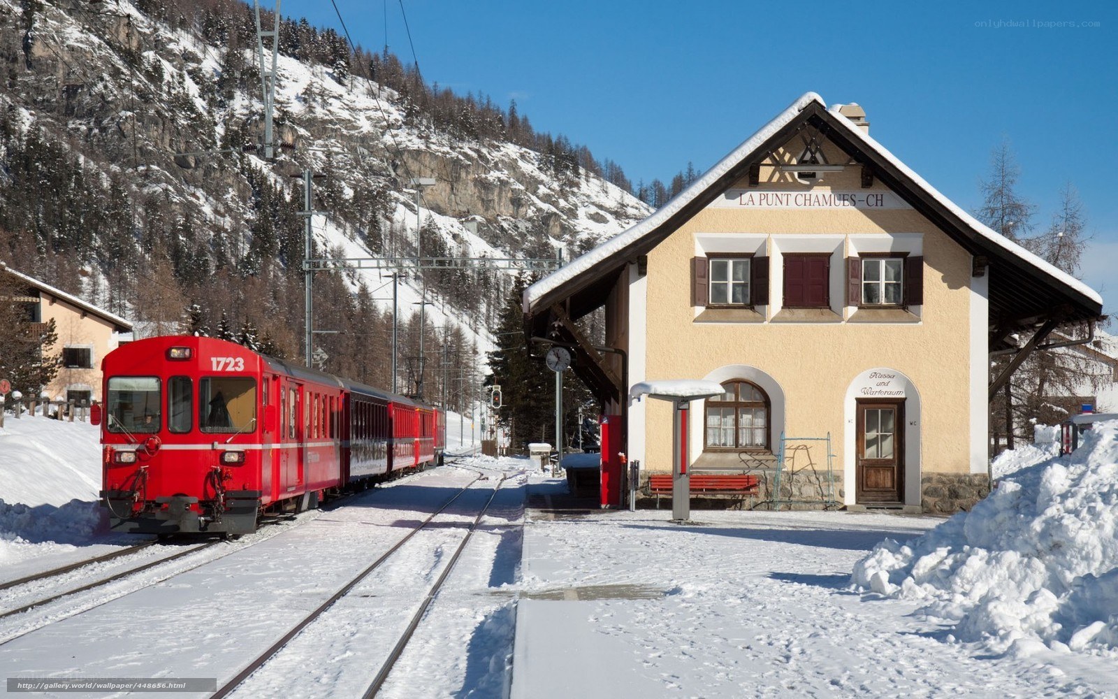 Red train at snowy station