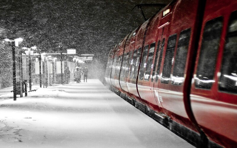 Red train at snowy station