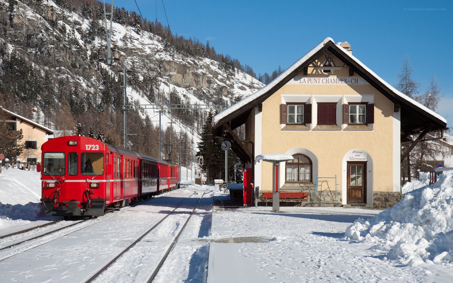Red train at snowy station