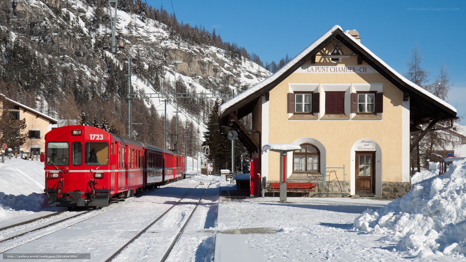 Red train at snowy station