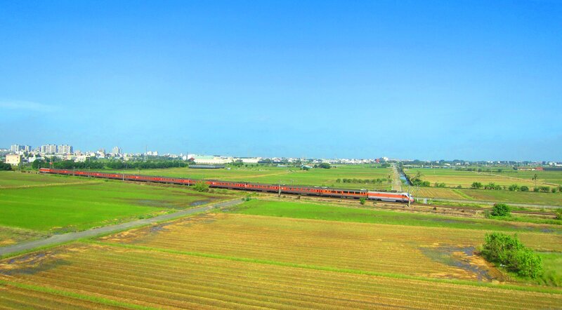 Red Train in Fields
