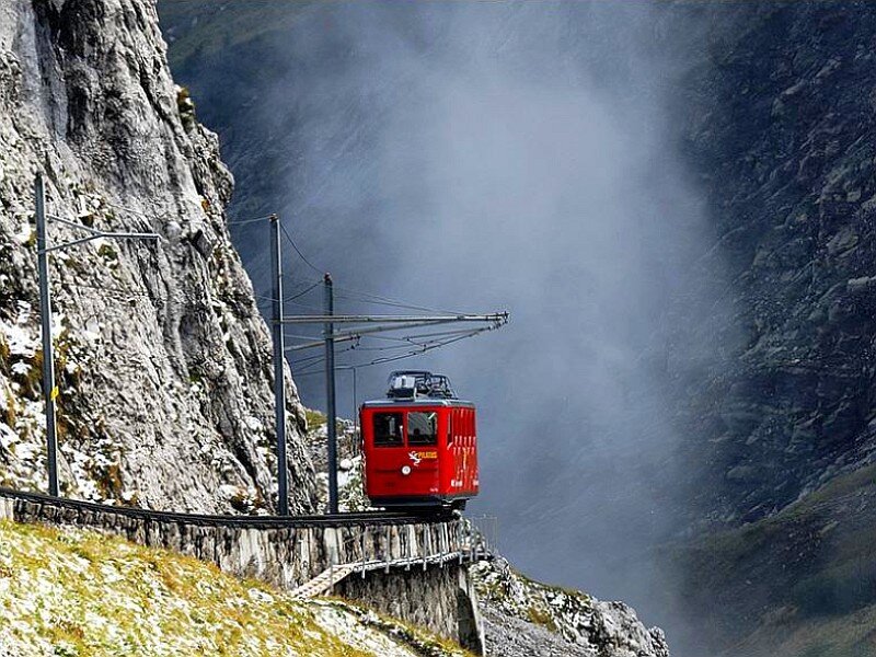 Red train in mountain valley