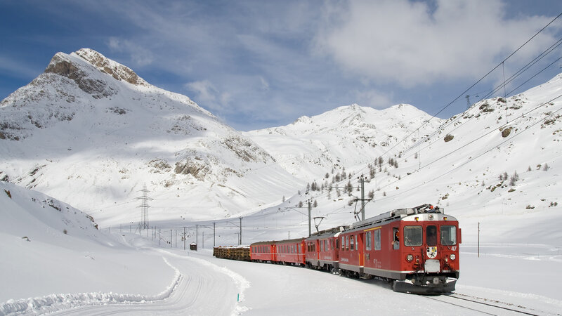 Red Train in Snow — Serene, Winter, Photograph, Snow-covered Mountains, Train Tracks
