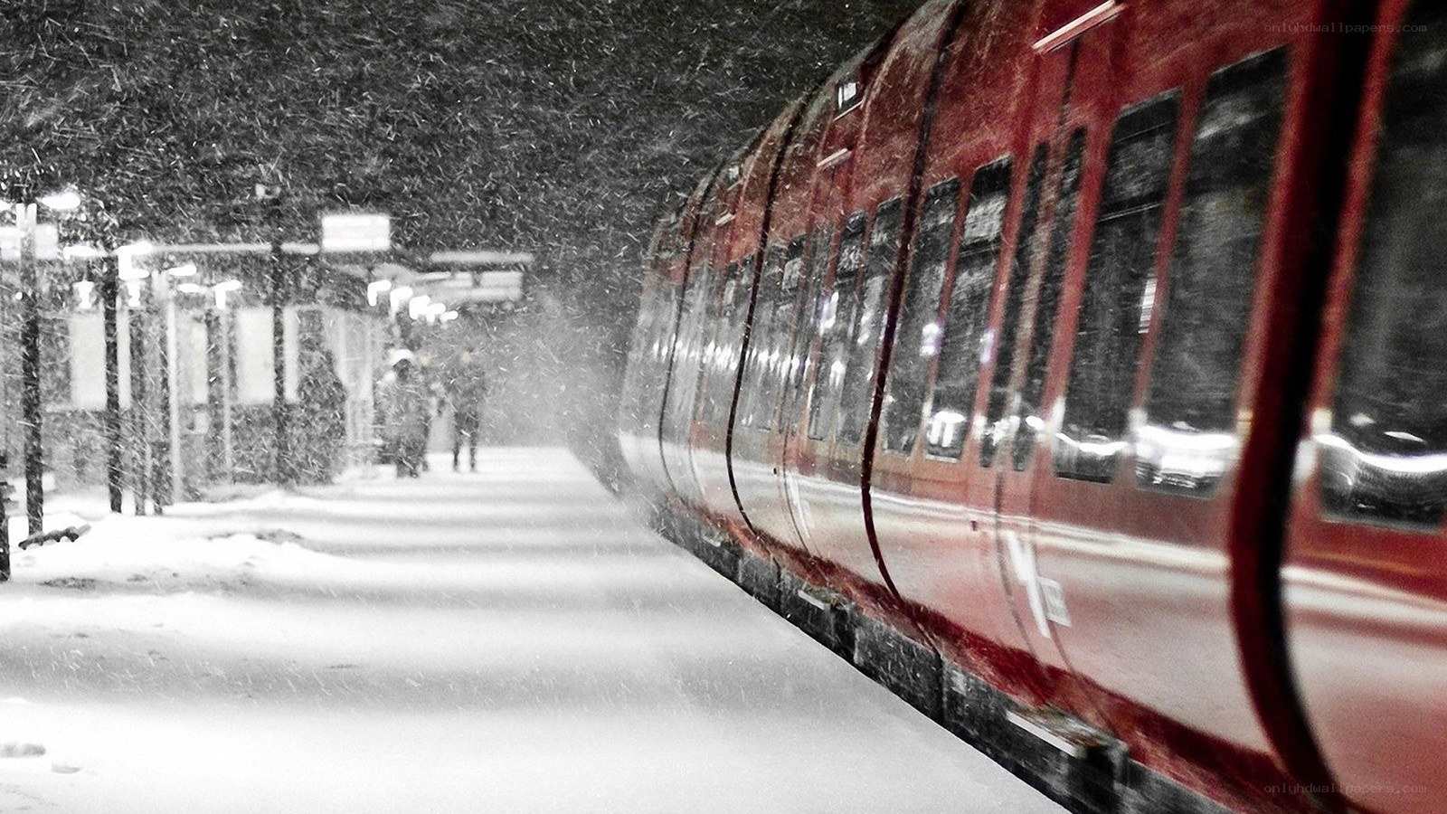 Red train in snowy station
