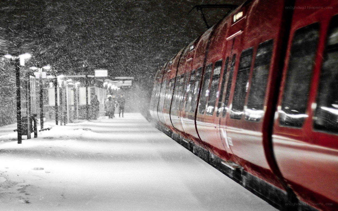 Red train in snowy station