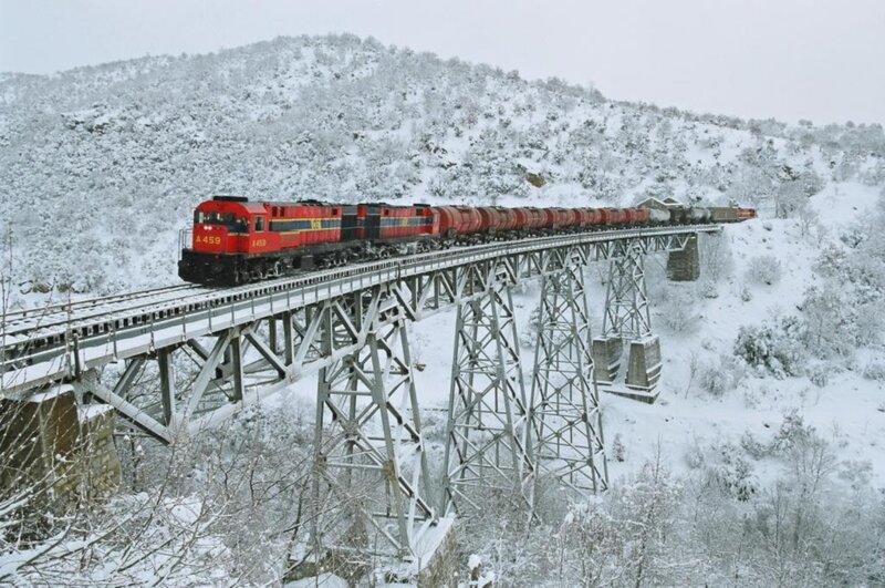 Red Train on Bridge — Cold